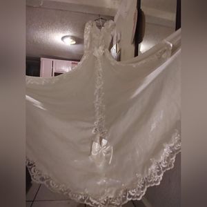 A exquisite one of a kind wedding dress with the petticoat size 8 petite